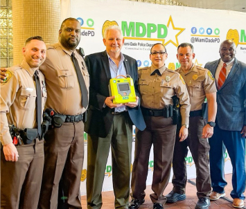 Left to right: Officer Ariel Trigo, Officer Shelton D. Green, survivor Tony Quintero, Officer Joandra Dobao, Director of Miami Dade Police Dept. Freddy Ramirez, and Damian Dollard (ZOLL).