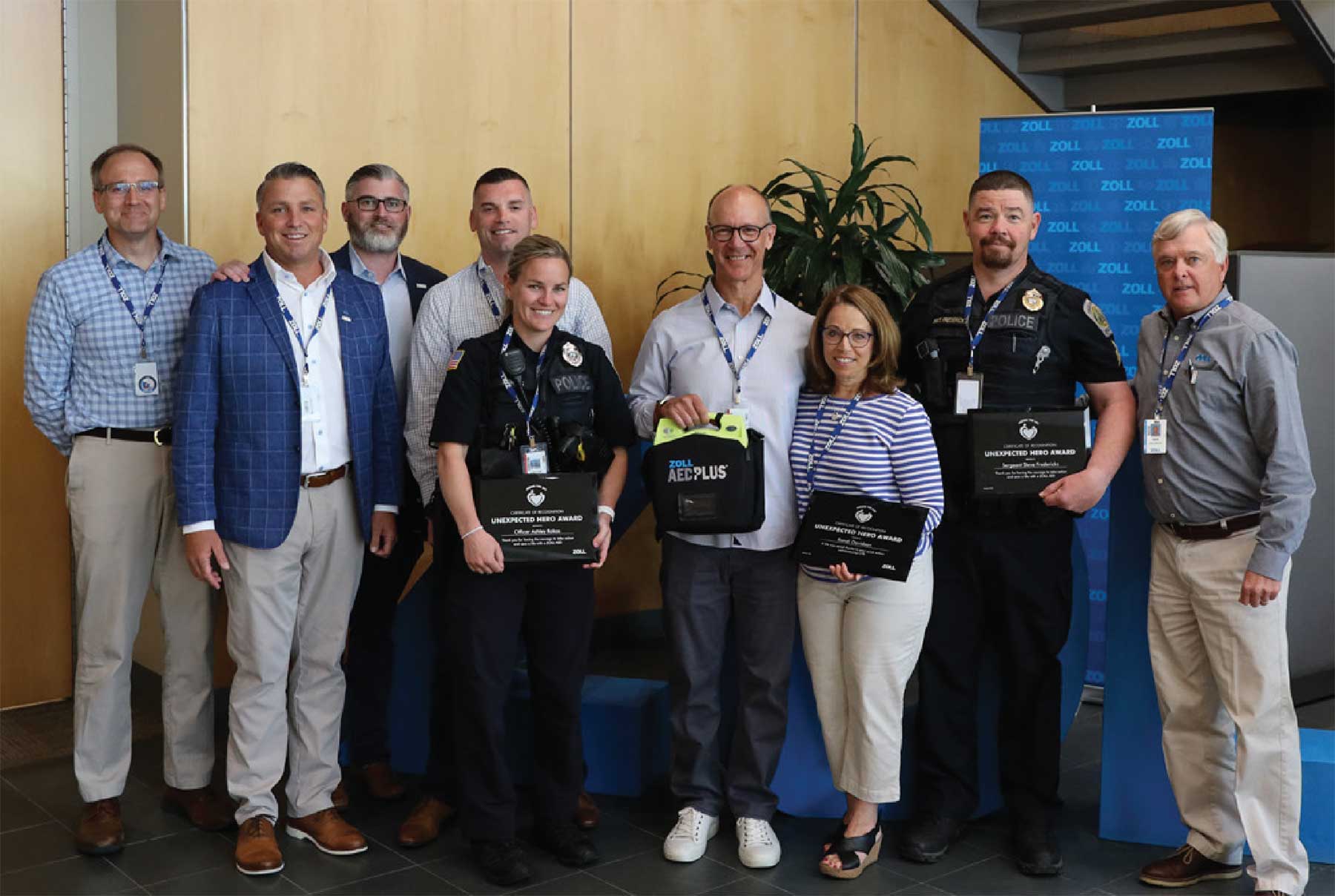 Left to right: Elijah White (ZOLL), Brent Brooks (ZOLL), Andrew Creen (ZOLL), Officer Aiden Gillis, Officer Ashley Rokas, Scott Davidson, Randi Davidson, Sergeant Fredericks, Gene McAuliffe (ZOLL)